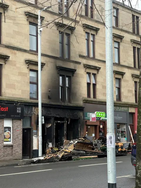 The fire has left a blackened front to the tenement building