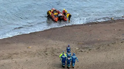 Whitby Coastguard The Whitby inshore lifeboat on the beach at Saltwick Bay, near Whitby.