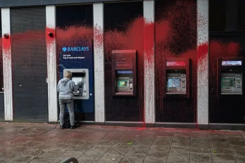 Getty Images Barclays branch sprayed with red paint in Croydon, south London