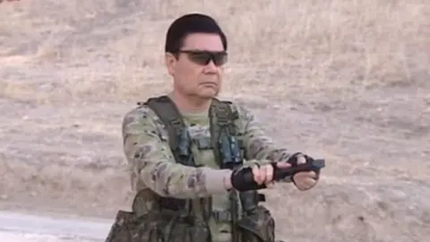 TURKMEN TV ALTYN ASYR 'Turkmenator' loads his weapon