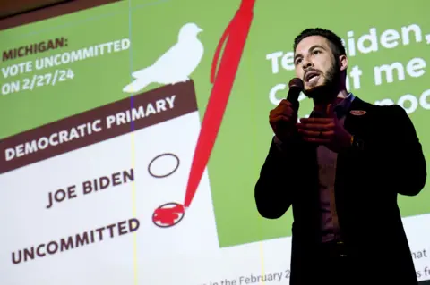 Getty Images Abdullah Hammoud, mayor of Dearborn, speaks during an election night gathering hosted by Listen to Michigan, a group urging residents to vote uncommitted in the Democratic presidential primary, in Dearborn, Michigan, US, on 27 February 2024