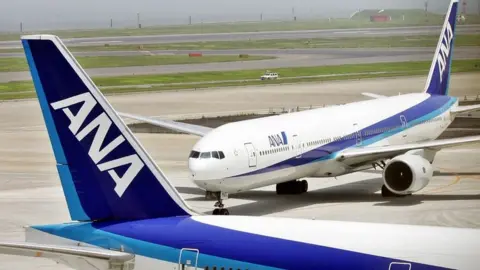 Getty/AFP ANA aircraft on tarmac at Tokyo Haneda airport