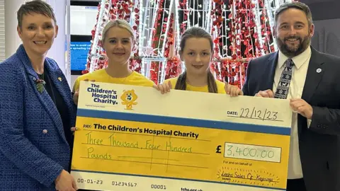 Craig Walton Leah (third from left) was personally thanked for her fundraising by the CEO of Sheffield Children's Hospital, Ruth Brown (left)