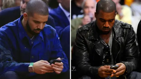 Getty Images Drake and Kanye West texting - but probably not each other