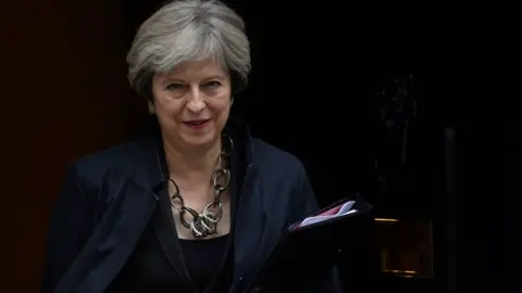 Reuters Theresa May leaves Downing Street