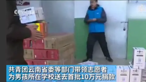 CCTV 13 Boxes of aid arriving at Little Wang's school