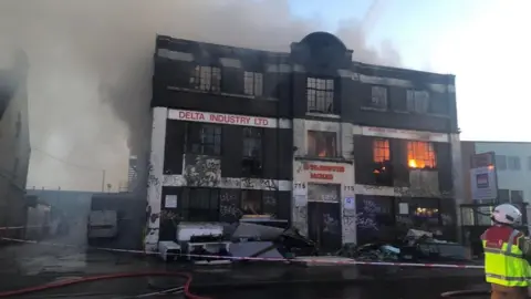 Neasden A406 North Circular fire causes rush hour delays