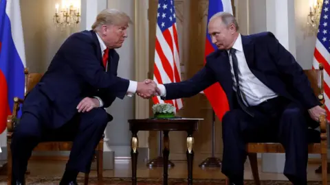 Reuters US President Donald Trump and Russia's President Vladimir Putin shake hands as they meet in Helsinki, Finland July 16, 2018