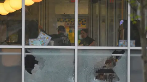 Reuters Shattered windows at the Waffle House in Nashville, 22 April