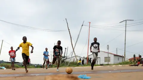 Reuters Children playing football on the streets of Soweto, South Africa - Tuesday 18 January 2022