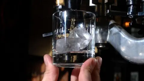 PA Bartender pouring whisky