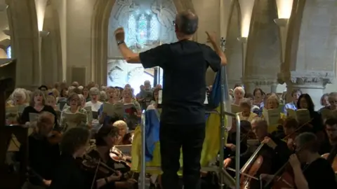 BBC David Backwell conducts the pop-up choir