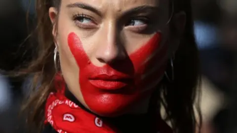 AFP A student marches to demand "non-sexist" education and to protest against the slow pace of educational reform in Santiago, on June 6, 201