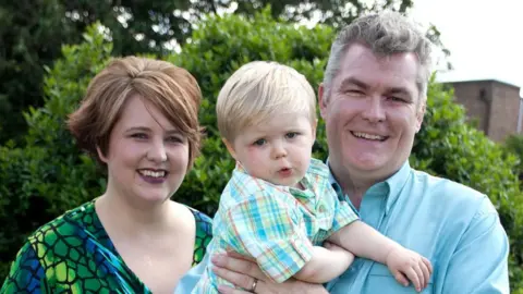 Family handout Family photo of Charlotte, Adam and his father