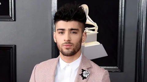 Getty Images Former One Direction star Zayn Maliktargeted has been targeted by cyberbullies because of his race