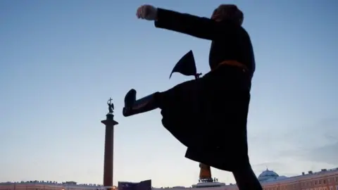 AFP/Getty Images A Russian honour guard marches during a military parade in St Petersburg. Photo: 27 January 2019