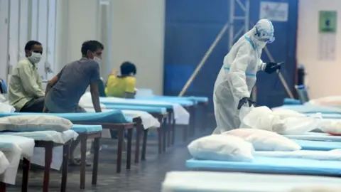 Getty Images A ward boy cleaning the ward