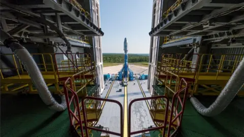 Reuters A Soyuz-2.1b rocket booster with a Fregat upper stage and satellites of British firm OneWeb is installed on a launchpad at the Vostochny Cosmodrome in Amur Region, Russia.