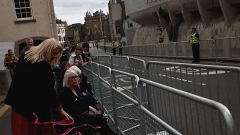 Reuters Crowds gather on the route of the cortege in Edinburgh