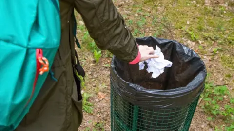 Liverpool City Council Person putting litter in bin