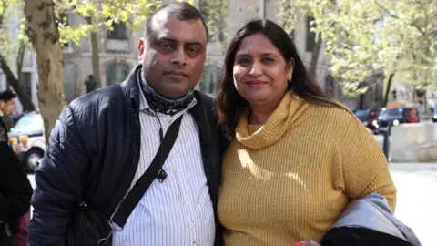 PA Media Former post office worker Seema Misra (right), who was jailed for a conviction of theft in 2010, celebrates with her husband Davinder outside the Royal Courts of Justice, London, after their convictions were overturned by the Court of Appeal.