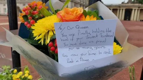 Card with flowers on gates