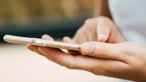 Health and Care Portsmouth Person holding phone