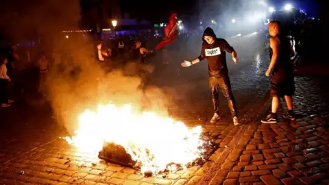 EPA Protesters burn rubbish in Hamburg. Photo: 5 July 2017