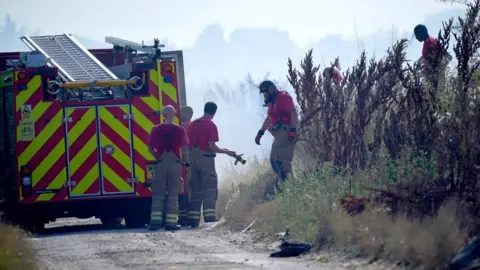 PA Media Fire crews in Wennington