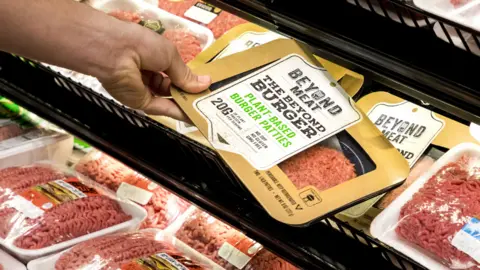 Beyond Meat A Beyond Burger pack being picked off a shelf