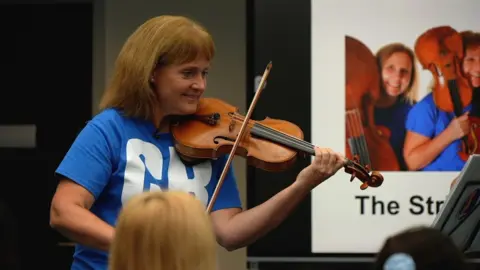 BBC/Neil Paton Catherine Arlidge, CBSO violinist says "if you can make a cake or a sandwich, you can make music because you just need the ingredients and some kind of recipe"