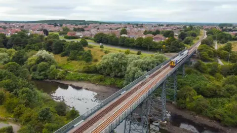 Northern Train crosses bridge