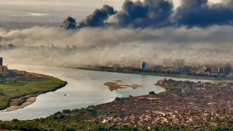 Getty Images Smoke drifting over Khartoum, April 2023