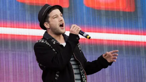 Getty Images Matt Cardle performs on stage with the cast of Memphis at the BBC Proms in the Park at Hyde Park