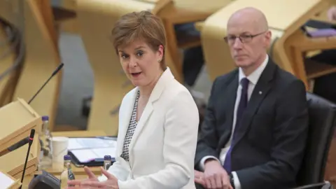 PA Media Nicola Sturgeon and John Swinney