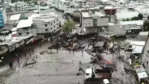 Mud covers ground in front of houses