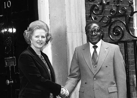 PA Margaret Thatcher and Robert Mugabe in 1980