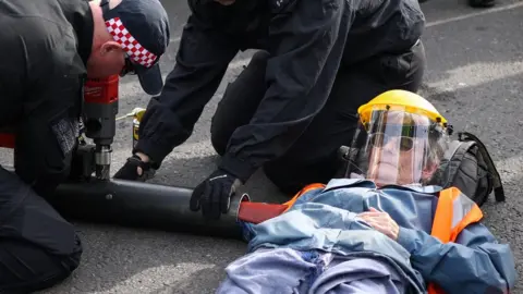 HENRY NICHOLLS/Reuters Just Stop Oil protest in London