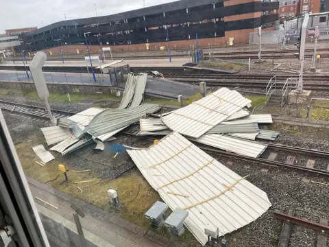 NetworkRail / PA Media The roof of a building blown onto railway tracks in Banbury, Oxfordshire, on 18 February 2022