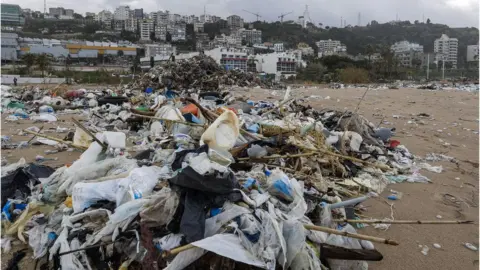 Getty Images Beach north of Beirut, covered with waste washed along the shore after stormy weather. 23 Jan 2017