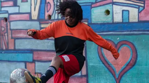 Gustavo Oliveira/WBR Photo Mayara practises weaving her foot around the ball on the training field