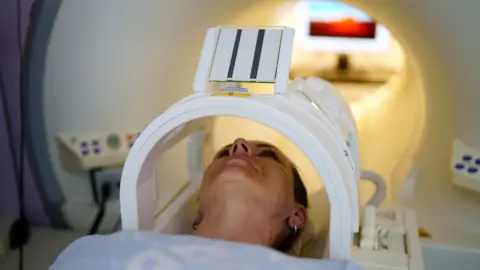 Getty Images woman going into scanner