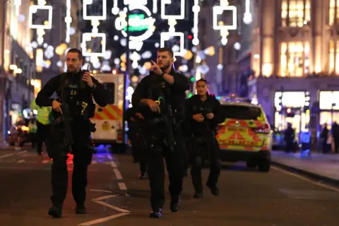 Getty Images Armed police on Oxford Street