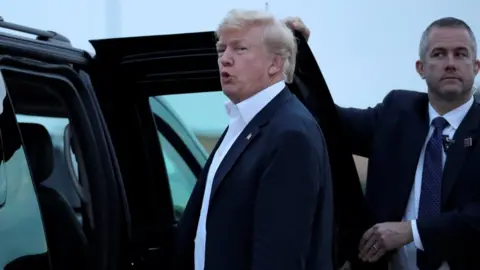 Reuters Donald Trump enters car