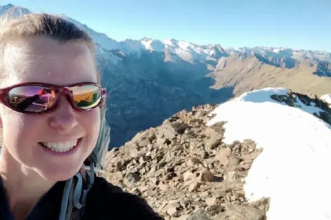 Esther Dingley Selfie of Esther on mountain top