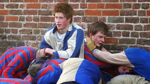 Getty Images Prince Harry playing the Eton Wall Game in 2003