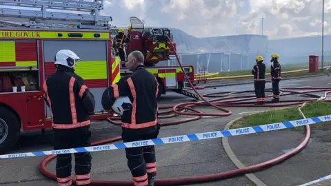 Firefighters at the scene of a large blaze