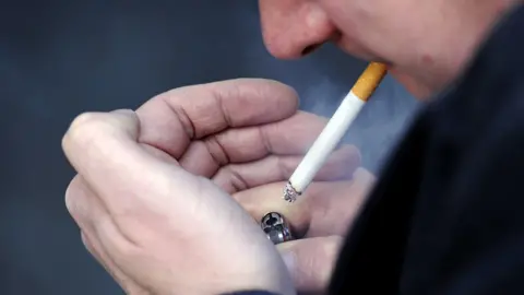 Jonathan Brady/PA Man smoking