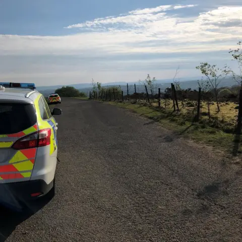 Gwent Police A police car near The Canyons