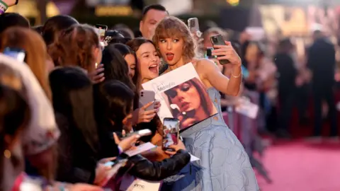 Getty Images Taylor Swift and fans